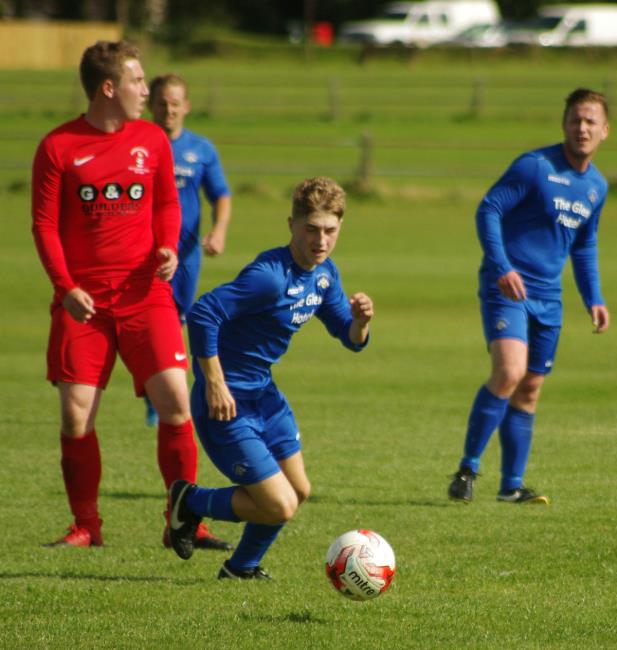 Jordan Thomas in possession for Merlins Bridge, the 16-year-old made his debut for the Wizards